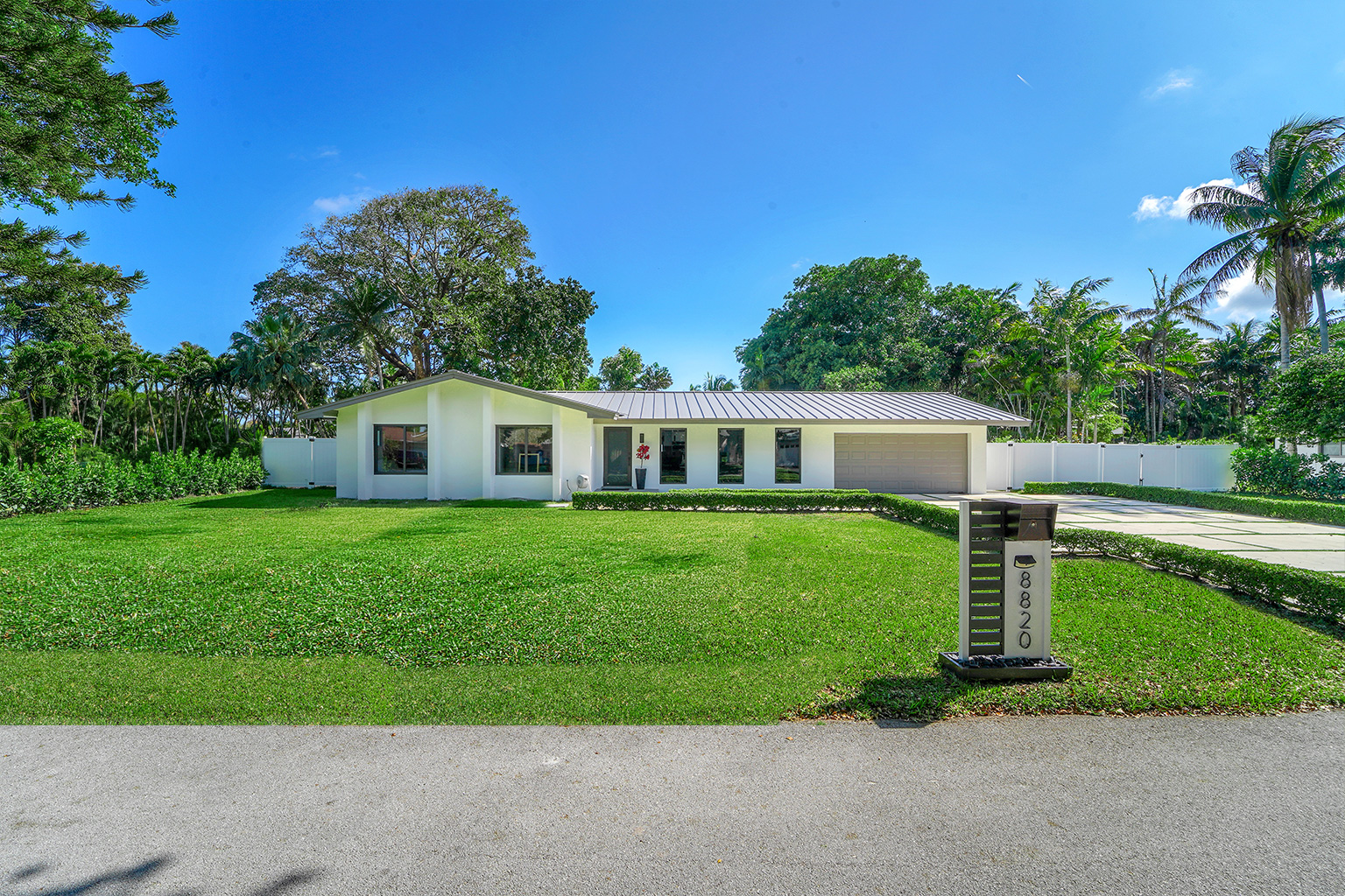 Front exterior with lush landscaping