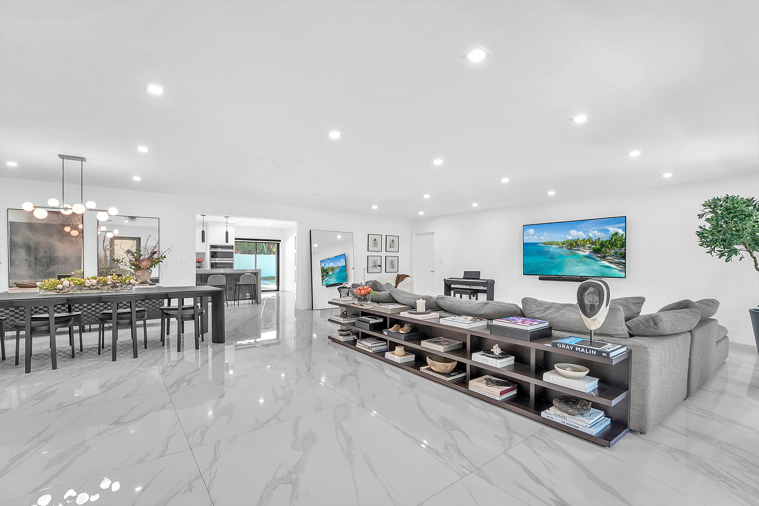 Open-concept living and dining with porcelain marble floors